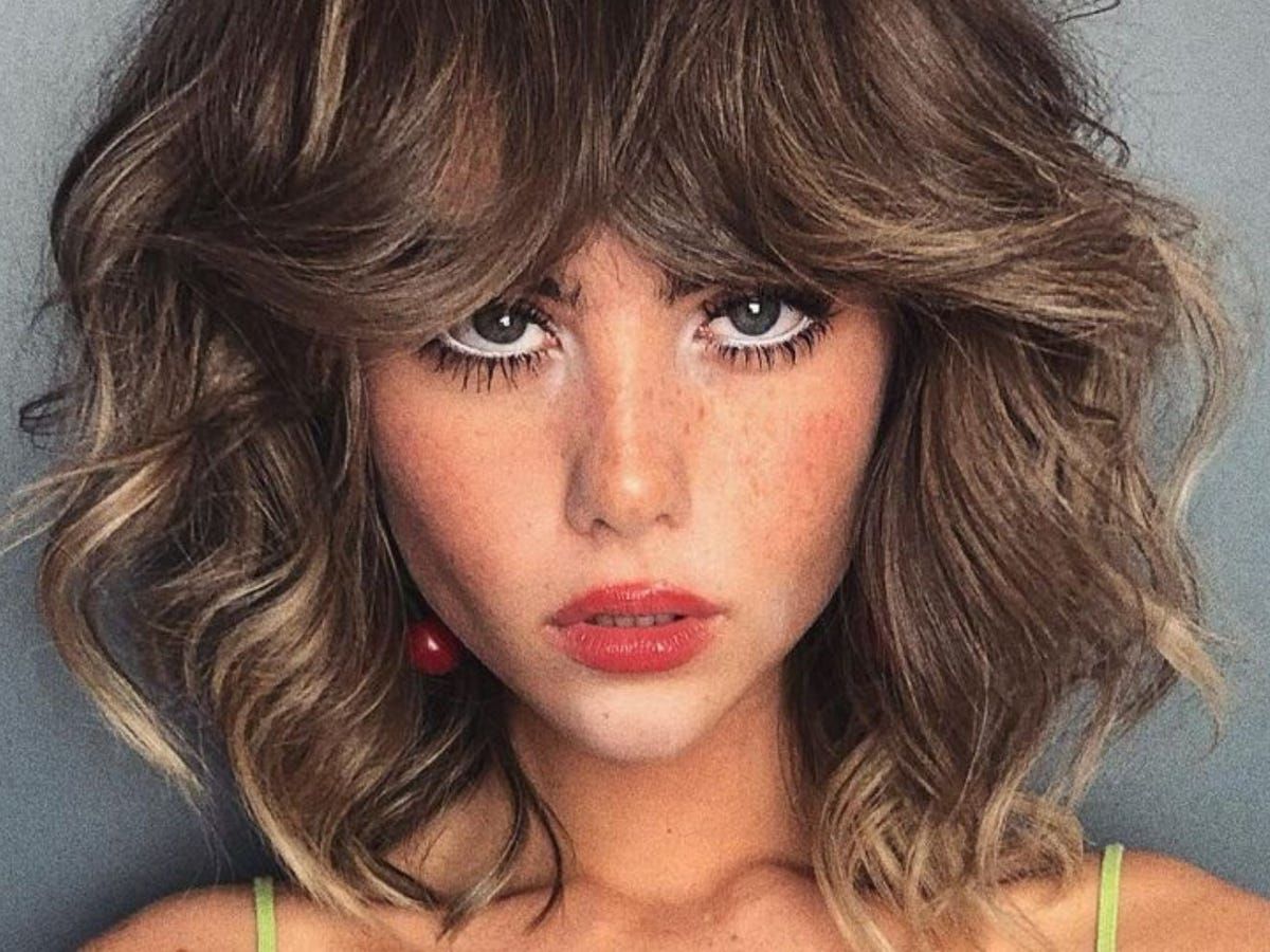 Dark Brown Collarbone Shag With Full Bangs Dark Brown Collarbone Shag With Full Bangs — Winter Haircuts for Heart Shaped Faces