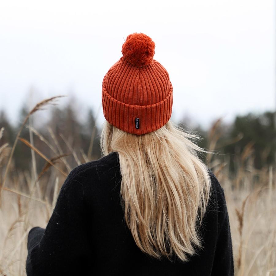 Mid-Back Light Blonde Waves With Orange Pom-Pom Hat — Close-Up Take — Winter Hat Hairstyles