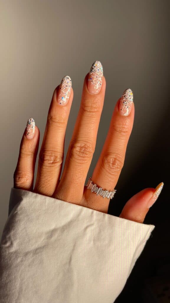 Scattered Holographic Glitter Almond Nails Scattered Holographic Glitter Almond Nails — Sparkly New Years Nails 2027