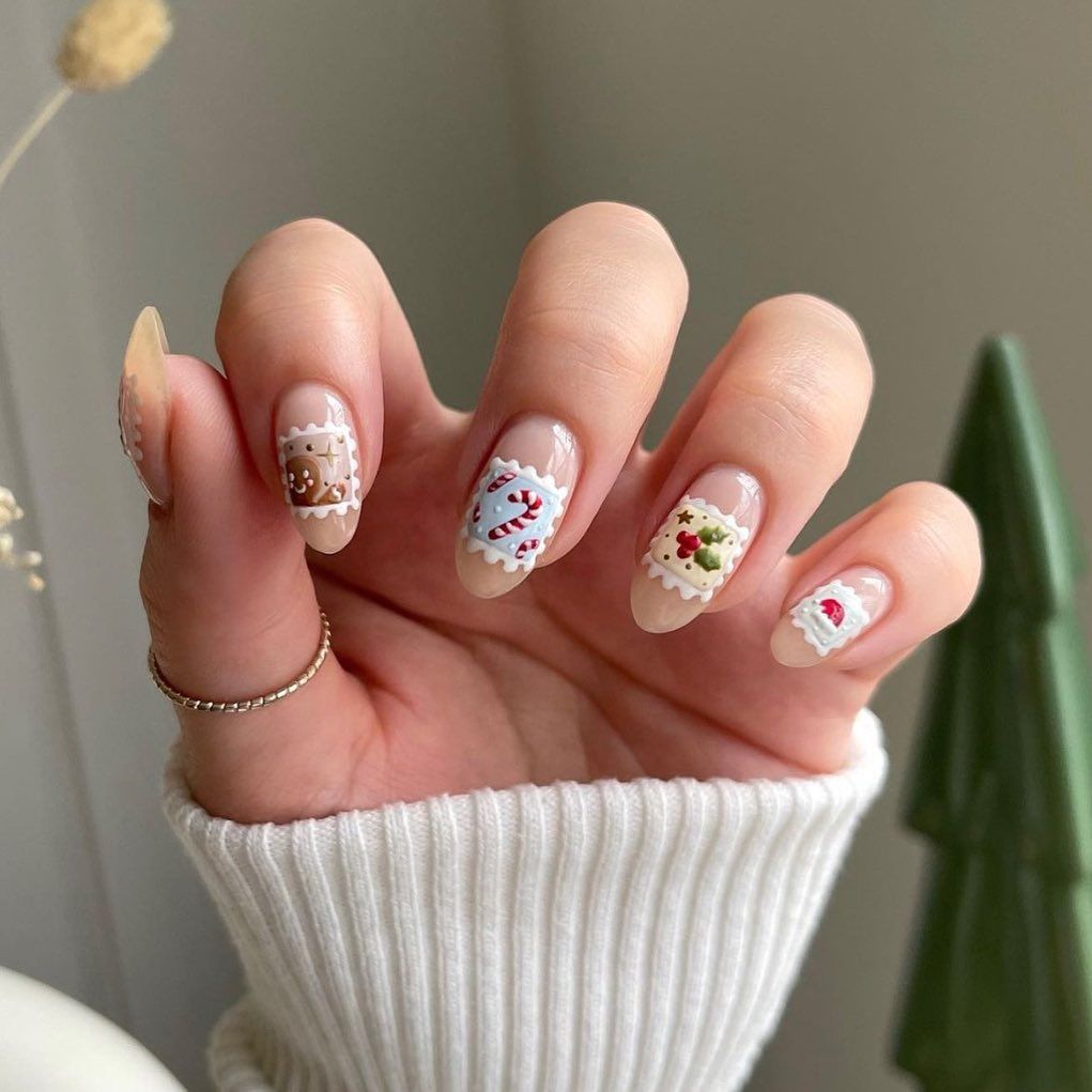 Playful Christmas Stamp Art Oval Nails Playful Christmas Stamp Art Oval Nails — Christmas Nail Trends 2026