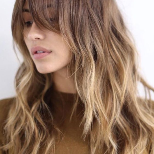 Collarbone Wavy With Side-Swept Bangs Collarbone Wavy With Side-Swept Bangs — Long Winter Haircuts