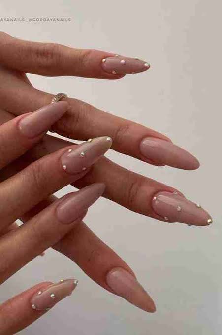 Nude Pink Stilettos with Rhinestones and Pearls Nude Pink Stilettos with Rhinestones and Pearls — New Years Stiletto Nails 2027