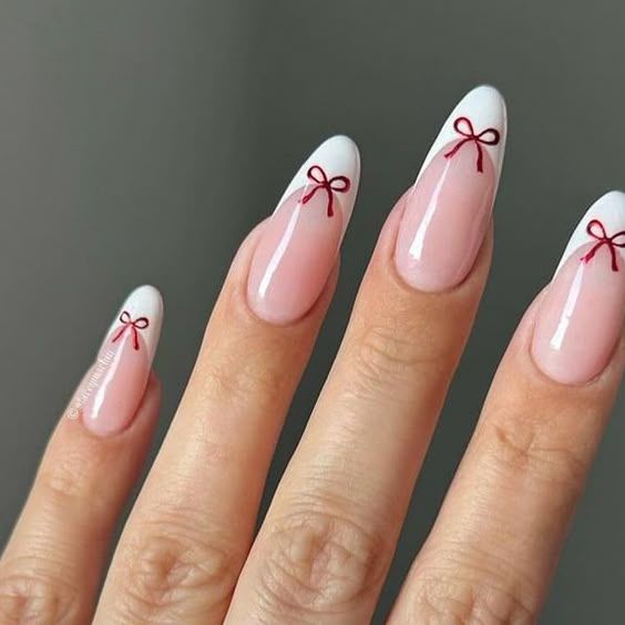 Nude French Red Bow Almond Nails Nude French Red Bow Almond Nails — Christmas Almond Nails 2026