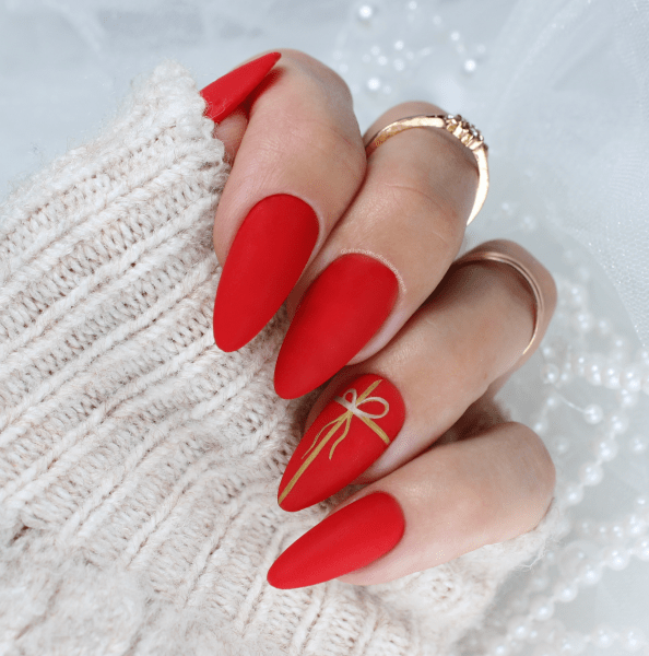 Matte Red Stiletto with Delicate Gold Bow Matte Red Stiletto with Delicate Gold Bow — Winter Bow Nails