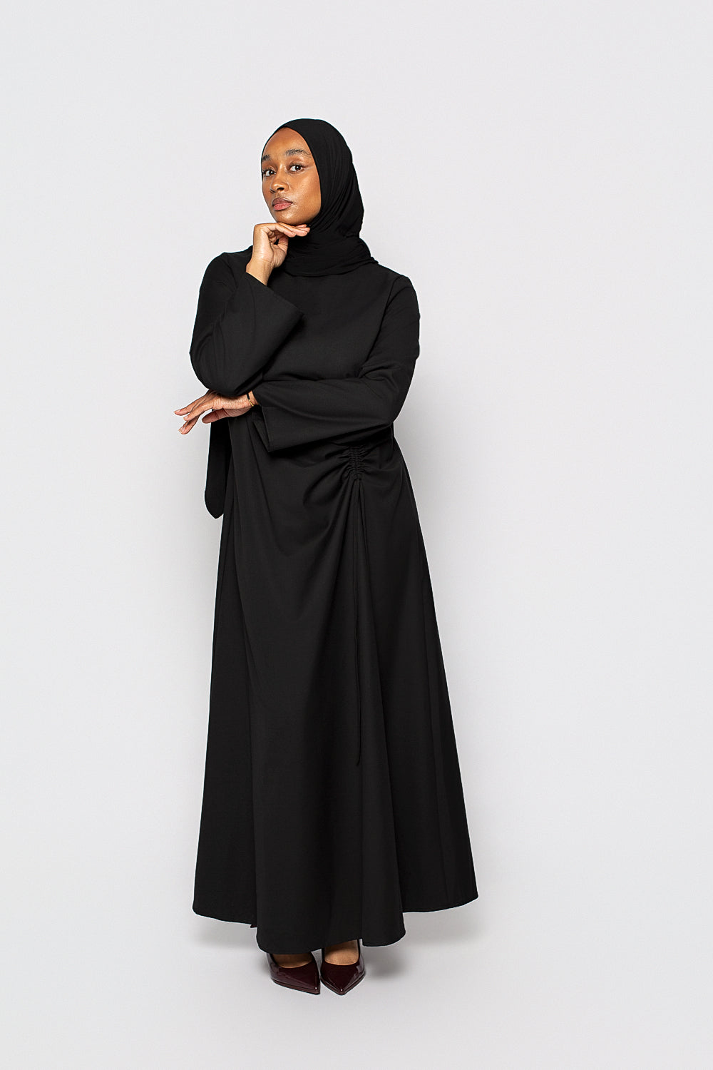 Elegant Black Dress with Ruched Side Detail Elegant Black Dress with Ruched Side Detail — Modest Winter Outfits