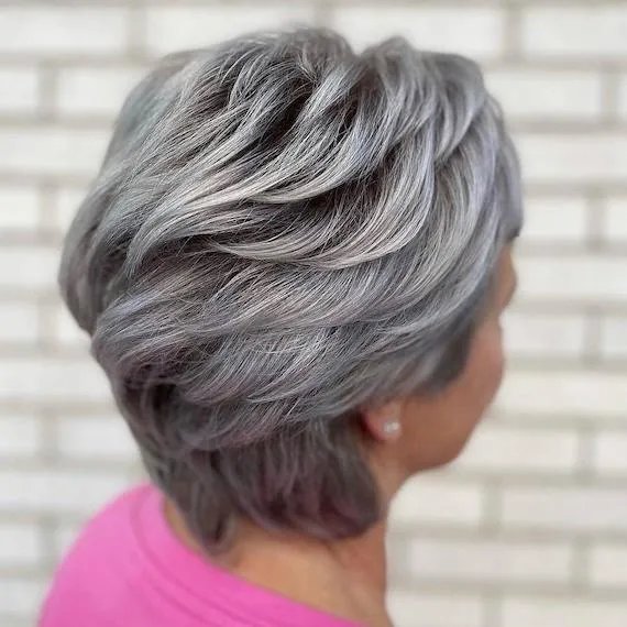 Layered Bob With Side-Swept Fringe Layered Bob With Side-Swept Fringe — Winter Haircuts for Gray Hair