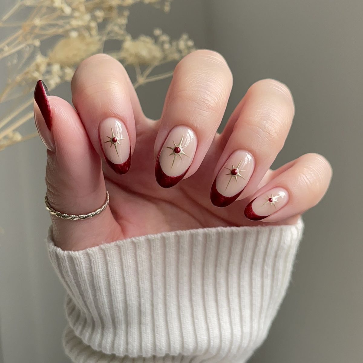 Nude Base Red French Tips with Gold Stars Nude Base Red French Tips with Gold Stars — Winter Nail Colors for Women Over 70