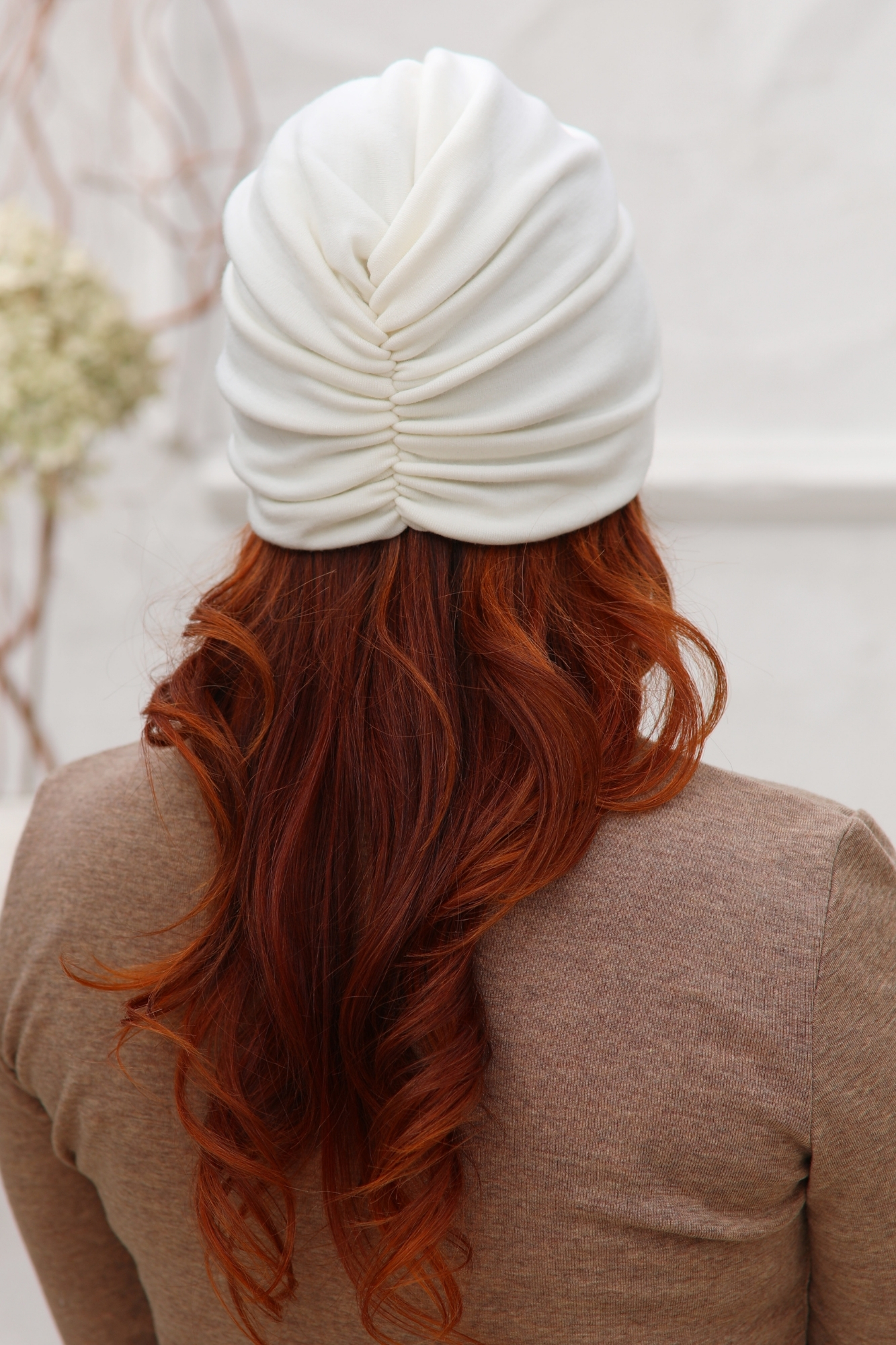 Collarbone Red Wavy With Cream Turban — Winter Hat Hairstyles