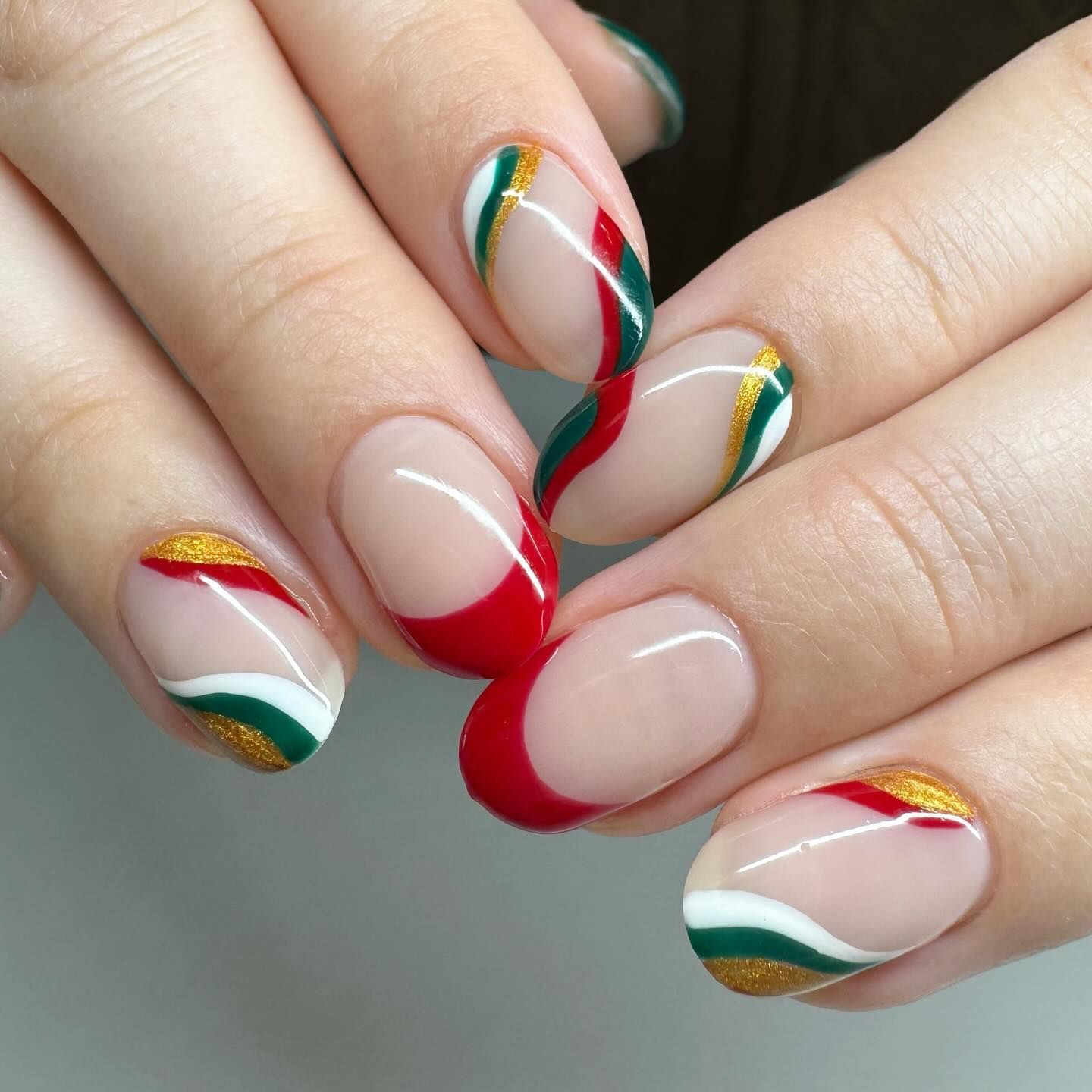 Nude Base with Wavy Festive French Tips Nude Base with Wavy Festive French Tips — Christmas Oval Nails 2026