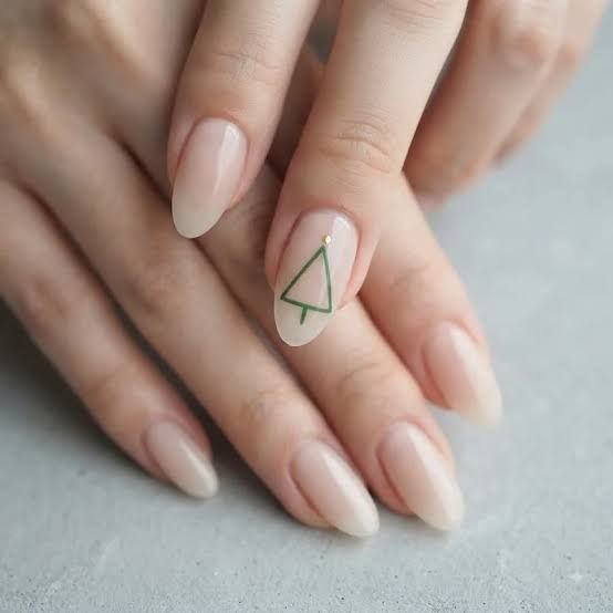 Minimalist Green Tree Outline Nude Nails Minimalist Green Tree Outline Nude Nails — Minimalist Christmas Nails 2026