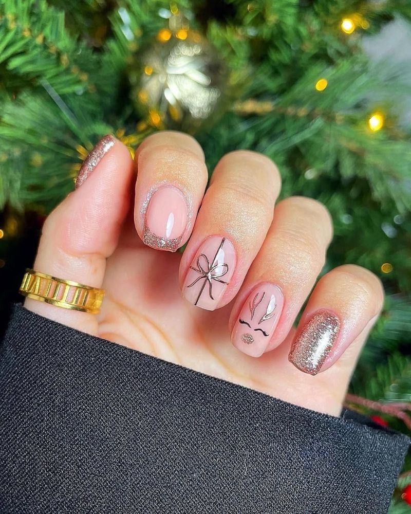 Nude Gold Glitter French Tips With Reindeer Nude Gold Glitter French Tips With Reindeer — Christmas Gel X Nails 2026