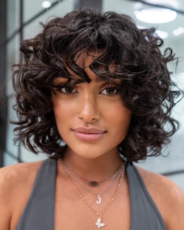 Voluminous Dark Brown Blowout Bob Voluminous Dark Brown Blowout Bob — Winter Hairstyles for Curly Hair