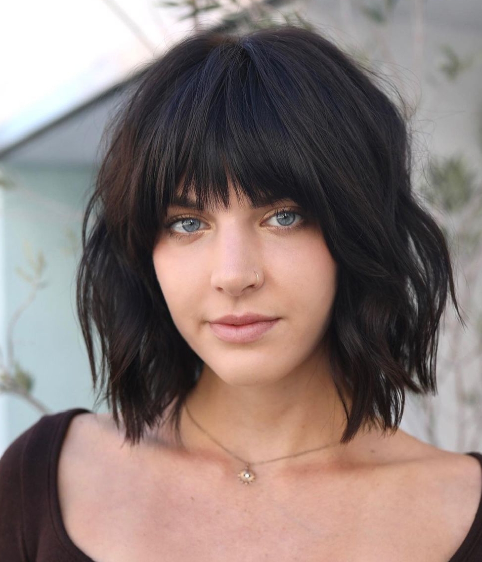 Wavy Collarbone Bob With Full Bangs Wavy Collarbone Bob With Full Bangs — Winter Haircuts for Round Faces