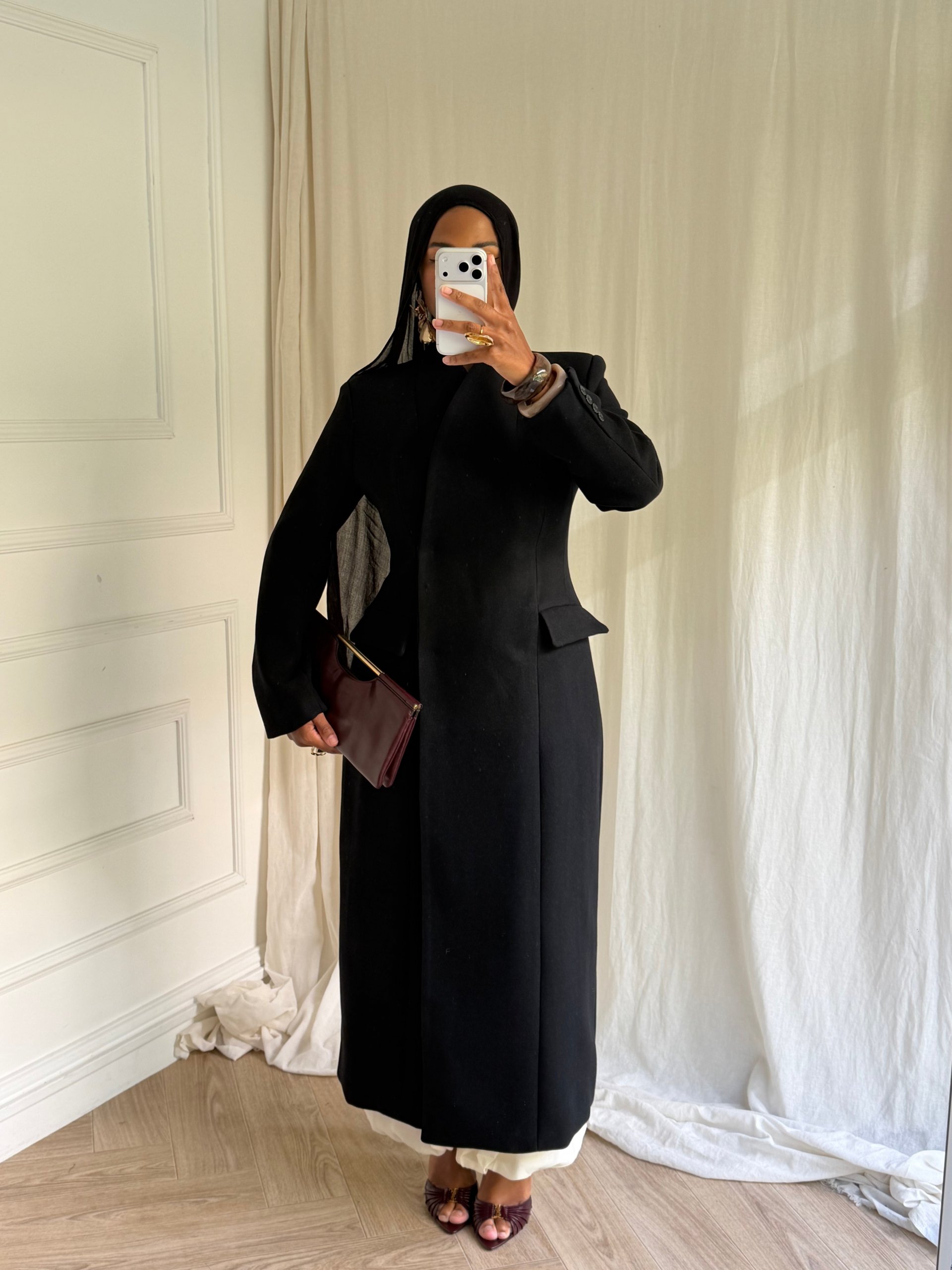 Sophisticated Black Coat Over a White Base Sophisticated Black Coat Over a White Base — Modest Winter Outfits