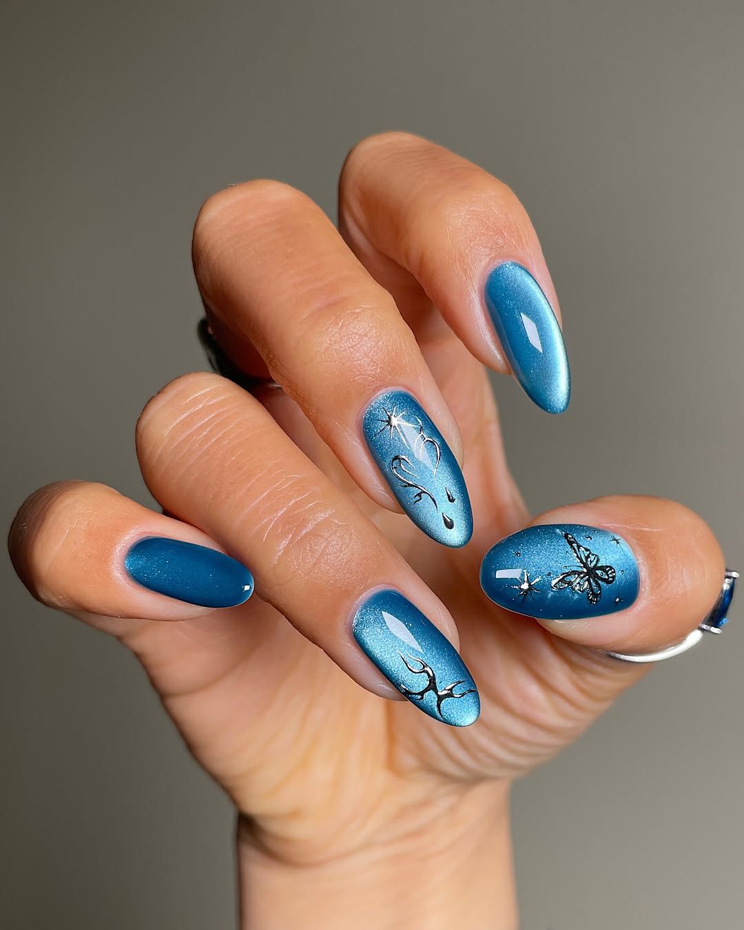 Deep Teal Cat-Eye with Star Accents Deep Teal Cat-Eye with Star Accents — Winter Birthday Nails