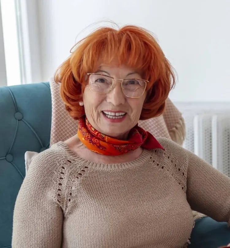 Vibrant Red Bob With Soft Bangs Vibrant Red Bob With Soft Bangs — Winter Haircuts for Women Over 70
