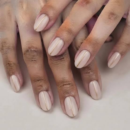 Pale Nude with Vertical Gold Line — Classy New Years Nails 2027