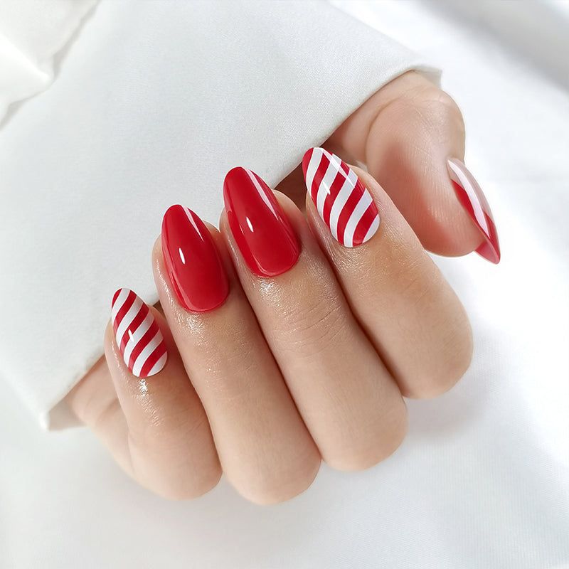 Vibrant Red Candy Cane Stripe Oval Nails Vibrant Red Candy Cane Stripe Oval Nails — Medium Christmas Nails 2026