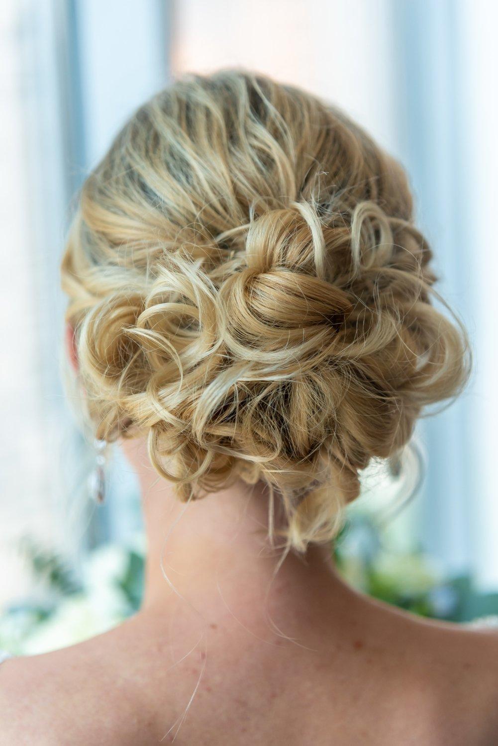 Blonde Loose Bun With Curls — Winter Wedding Guest Hairstyles