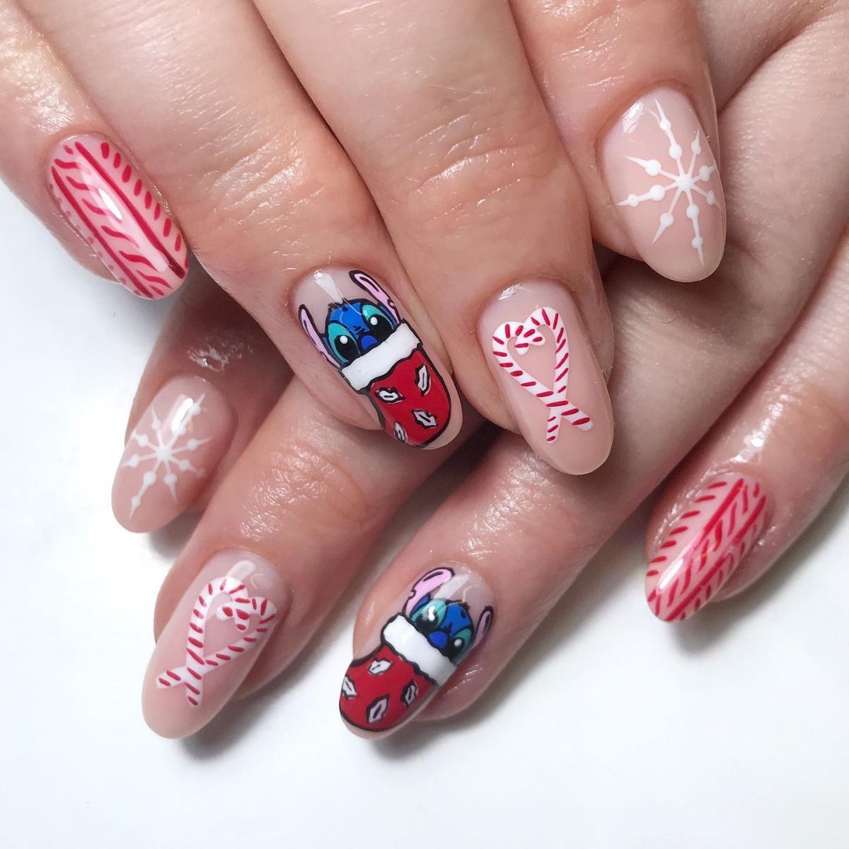 Sheer Nude with Stitch and Candy Canes Sheer Nude with Stitch and Candy Canes — Disney Christmas Nails 2026