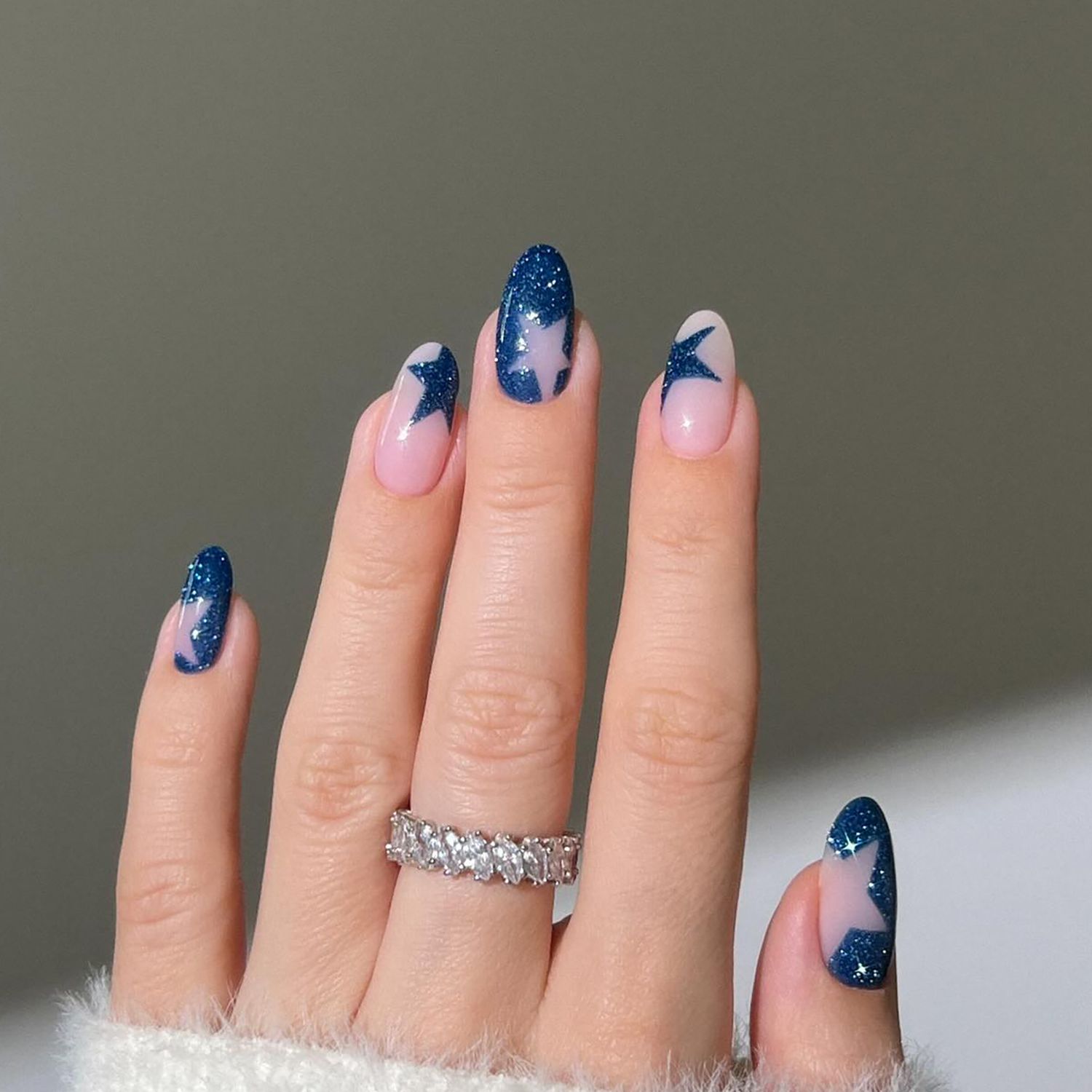 Navy Glitter Star Cutout Almond Nails Navy Glitter Star Cutout Almond Nails — Cozy Winter Nails
