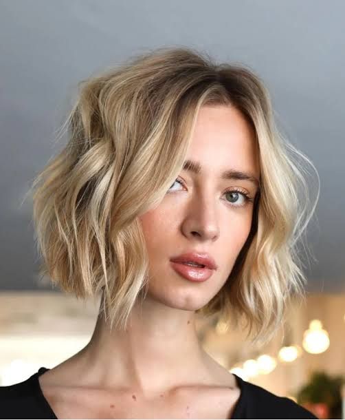 Sleek Angled Honey Blonde Bob — The Hair Is Honey Blonde Sleek Angled Honey Blonde Bob — The Hair Is Honey Blonde — Winter Haircuts for Heart Shaped Faces