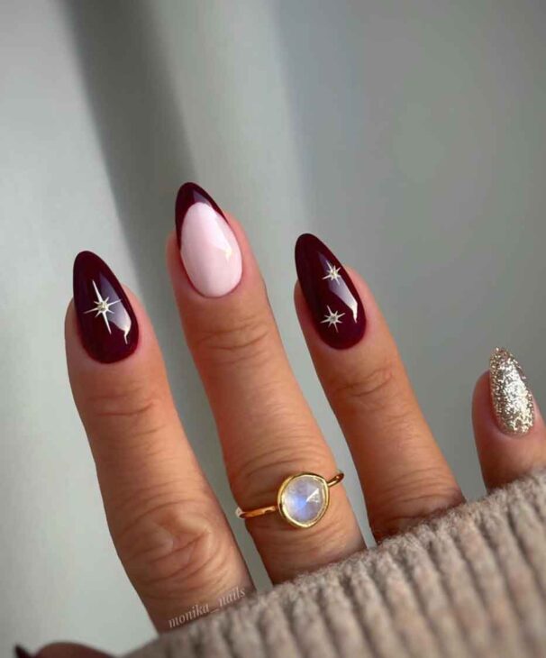 Burgundy Almonds with Gold Starbursts and Glitter Burgundy Almonds with Gold Starbursts and Glitter — Burgundy Christmas Nails 2026