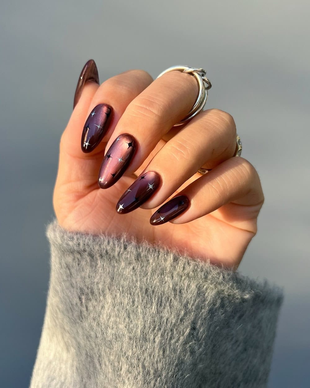 Magnetic Cat-Eye Brown with Gold Stars Magnetic Cat-Eye Brown with Gold Stars — Winter Nail Trends