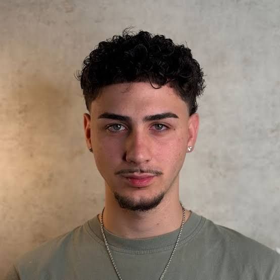 Short Curly Crop With Faded Sides — Winter Haircuts for Men