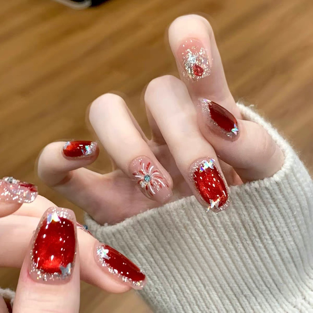 Red Cat-Eye Nails With Glitter Accents Red Cat-Eye Nails With Glitter Accents — New Years Press On Nails 2027