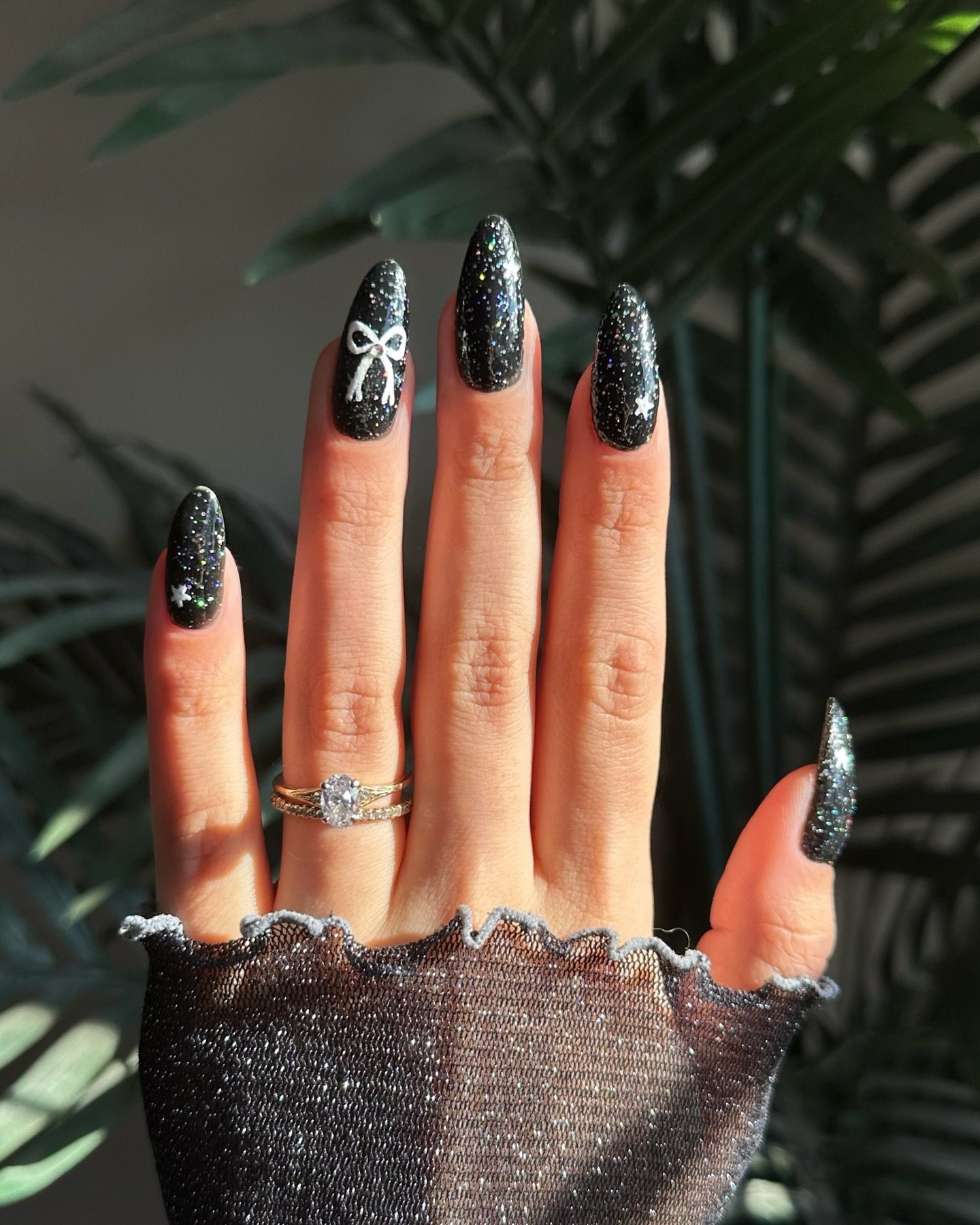 Black Glitter with White Bow and Stars Black Glitter with White Bow and Stars — Easy New Years Nails 2027