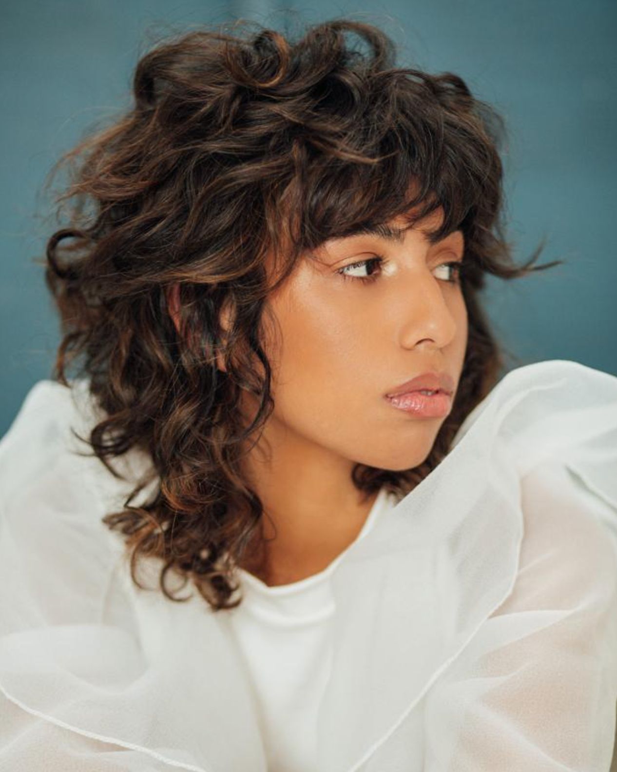 Textured Shag With Curly Bangs Textured Shag With Curly Bangs — Winter Hairstyles for Curly Hair