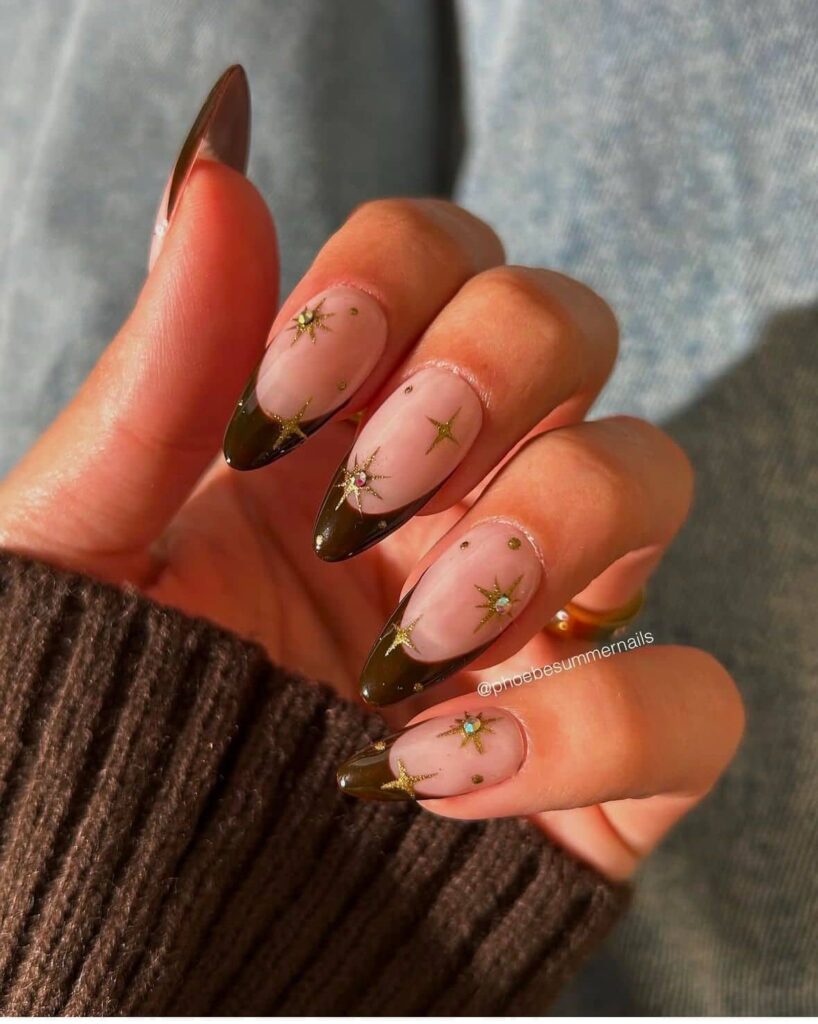 Sheer Nude French Tips with Gold Starbursts and Rhinestones Sheer Nude French Tips with Gold Starbursts and Rhinestones — New Years Nails 2027