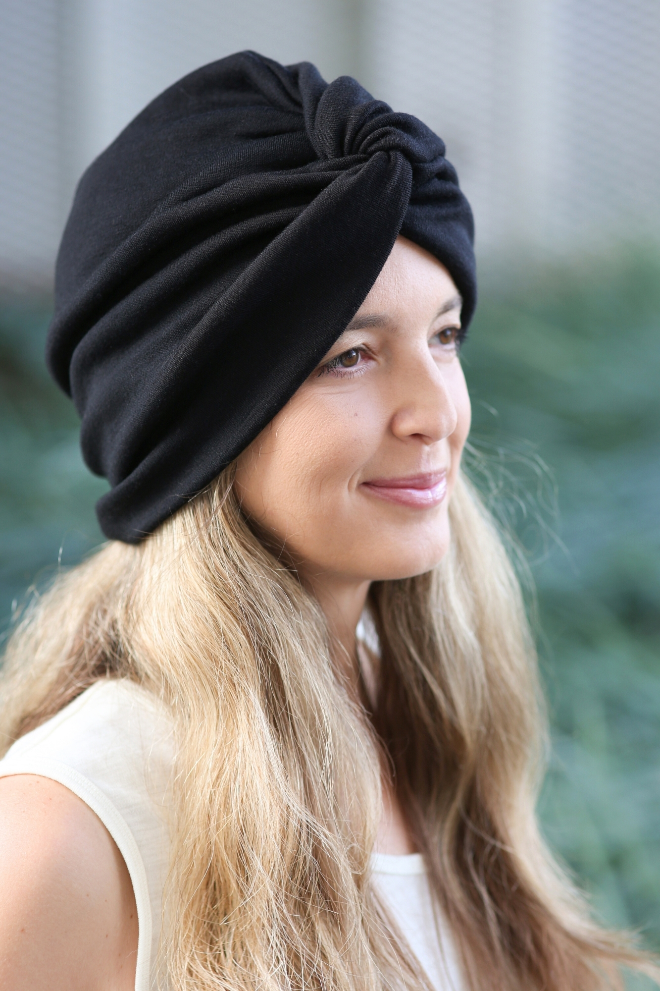 Mid-Back Blonde Waves With Turban Hat — Winter Hat Hairstyles