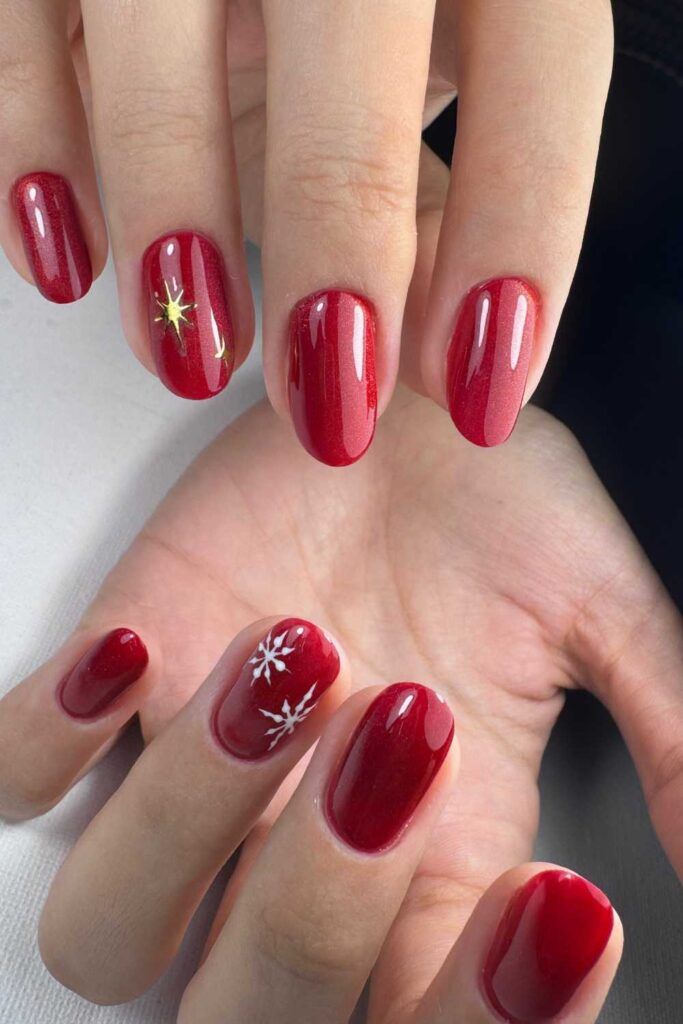 Shimmering Red with Gold Star and Moon Accents Shimmering Red with Gold Star and Moon Accents — Short Christmas Nails 2026