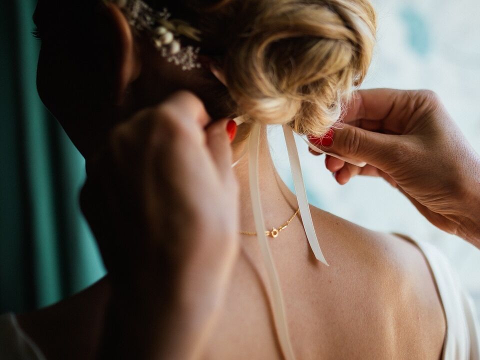 Textured Blonde Updo With Ribbon — Winter Wedding Guest Hairstyles