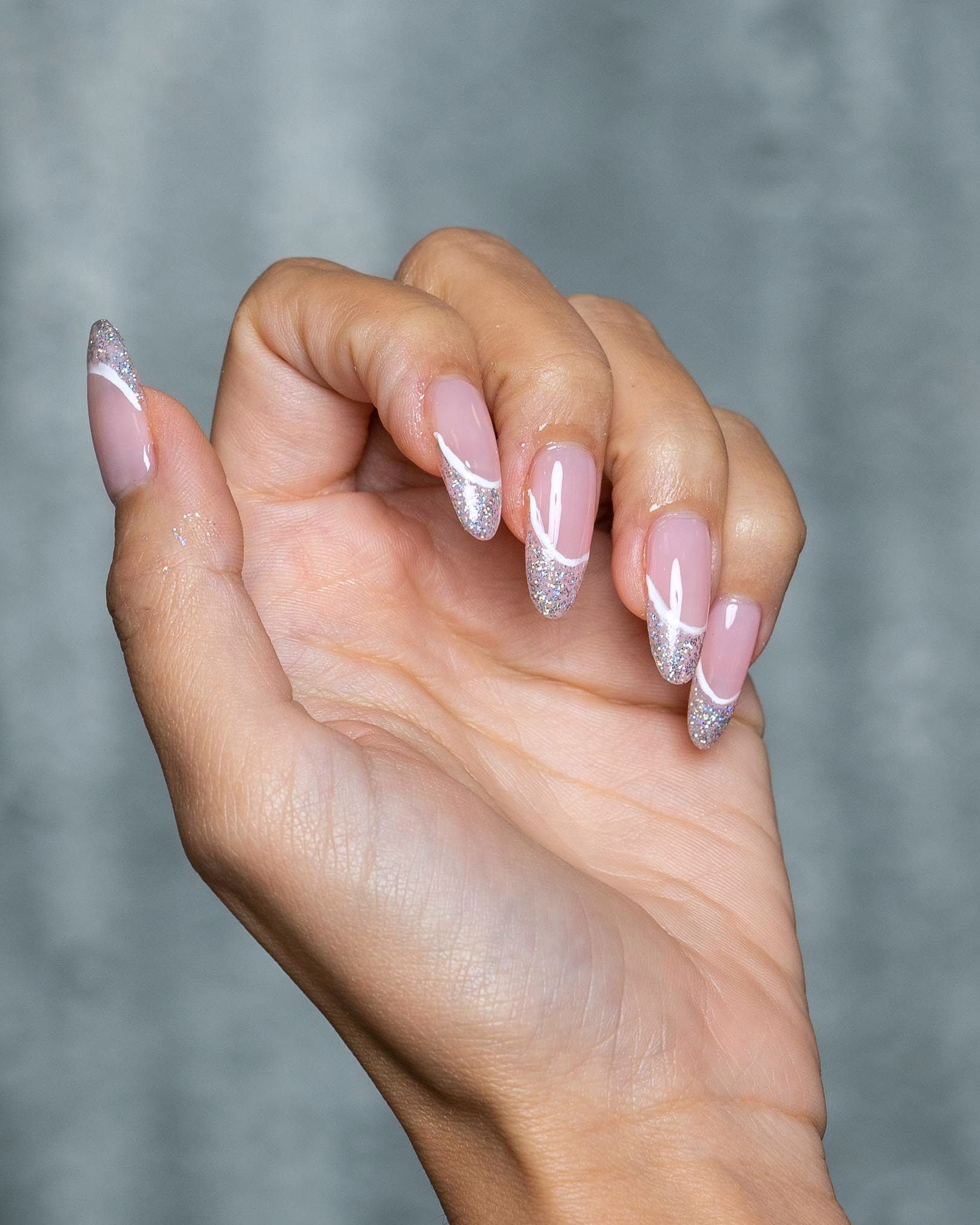 Glossy Base Glitter Silver Glitter French Tip Almond Nails Glossy Base Glitter Silver Glitter French Tip Almond Nails — Sparkly New Years Nails 2027