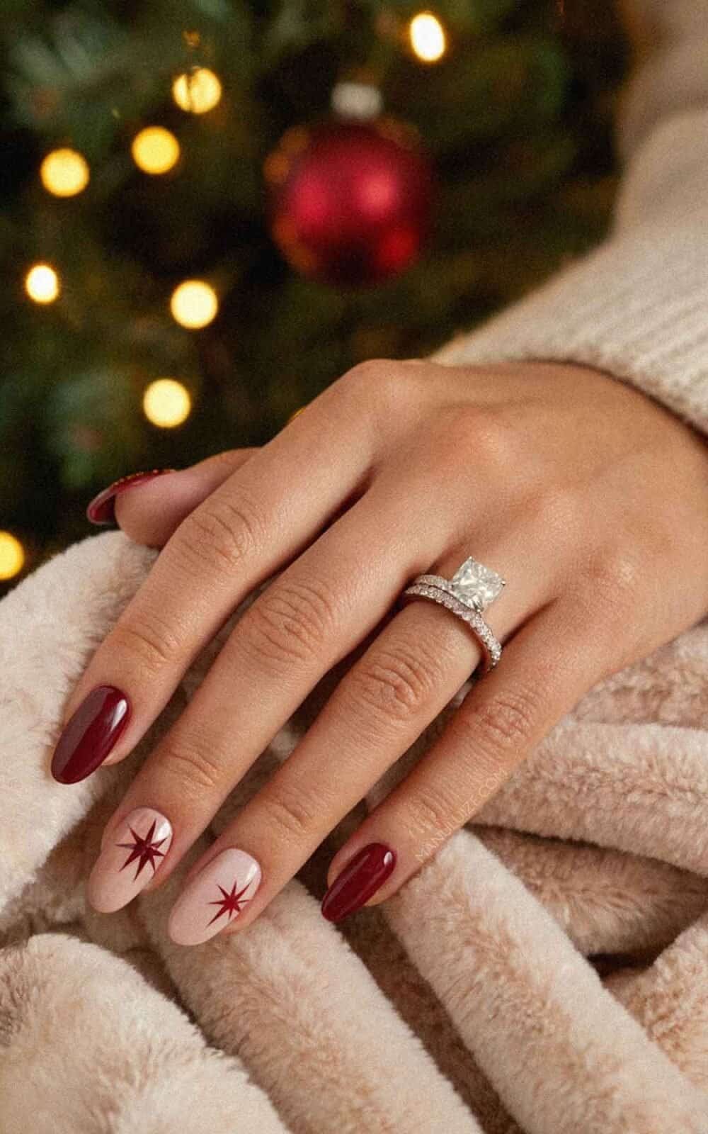 Burgundy Almonds with Pale Pink Starbursts Burgundy Almonds with Pale Pink Starbursts — Burgundy Christmas Nails 2026