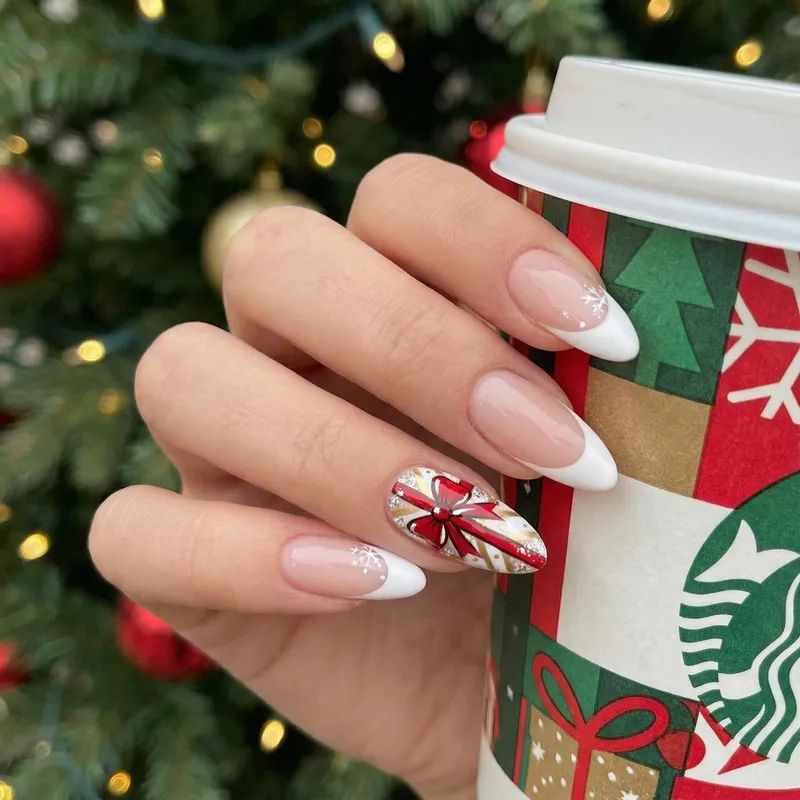 Classic French with Christmas Ribbon Accent Classic French with Christmas Ribbon Accent — Medium Christmas Nails 2026