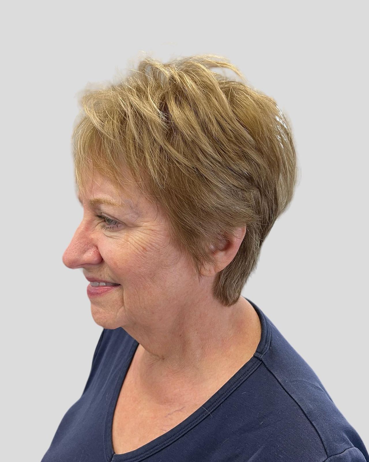 Blonde Layered Bob With Side Bangs Blonde Layered Bob With Side Bangs — Winter Haircuts for Women Over 70