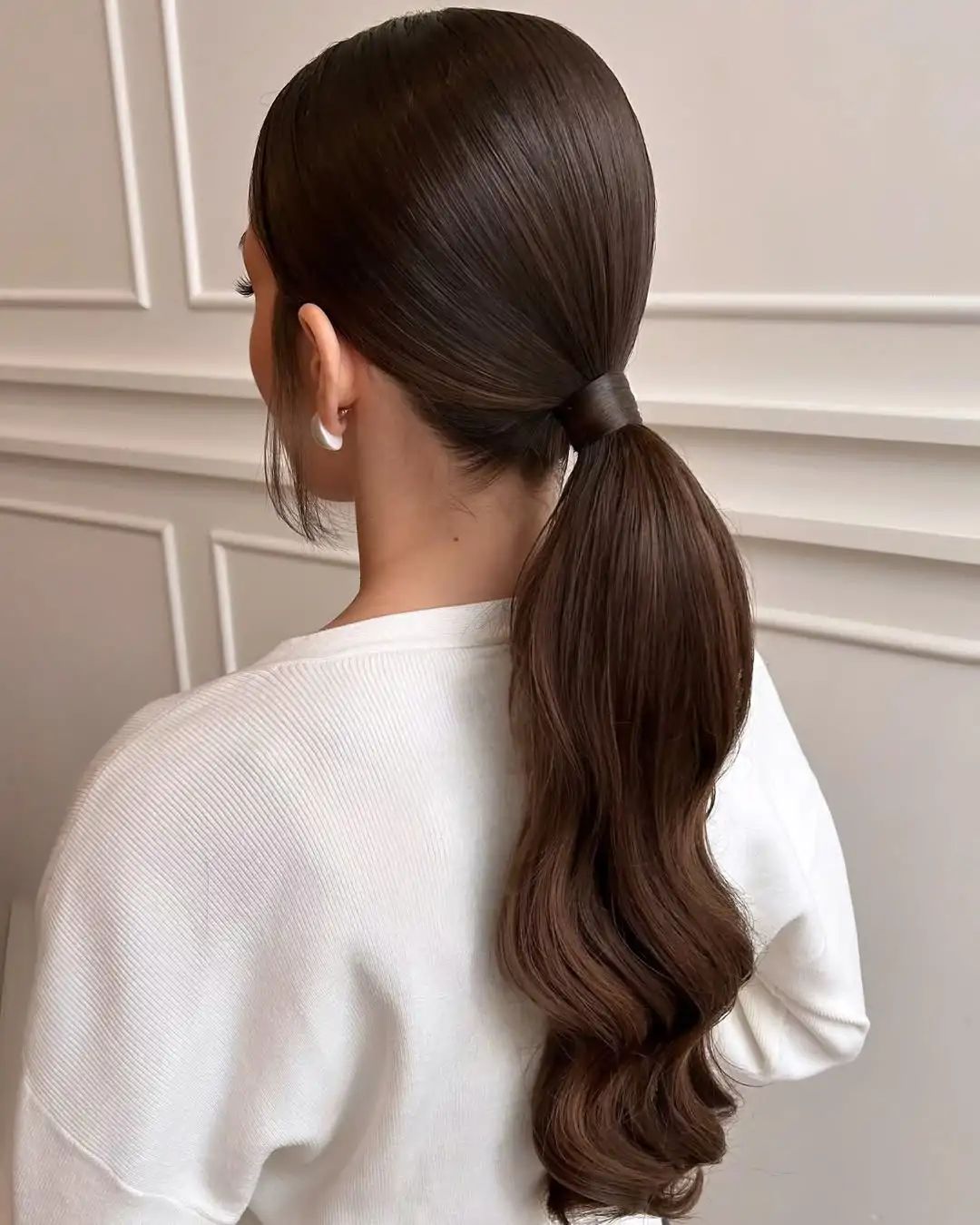 Sleek Dark Brown Ponytail With Gentle Waves Sleek Dark Brown Ponytail With Gentle Waves — Winter Ponytail Hairstyles
