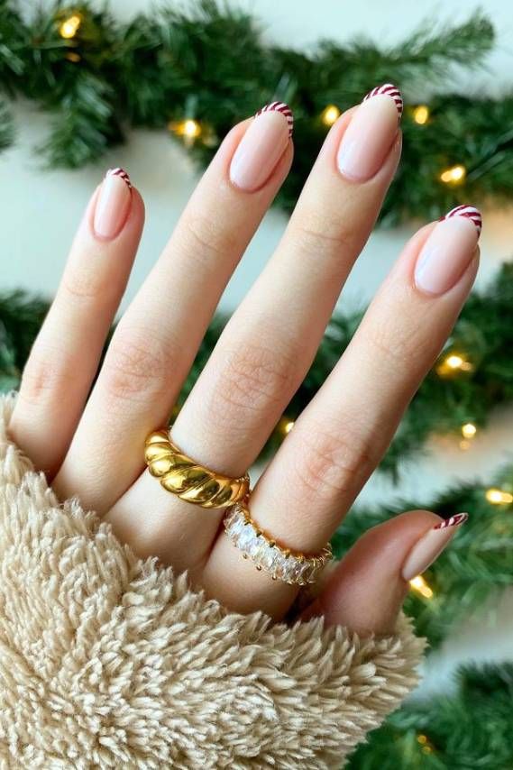 Sheer Nude Candy Cane Striped Tips Sheer Nude Candy Cane Striped Tips — Minimalist Christmas Nails 2026