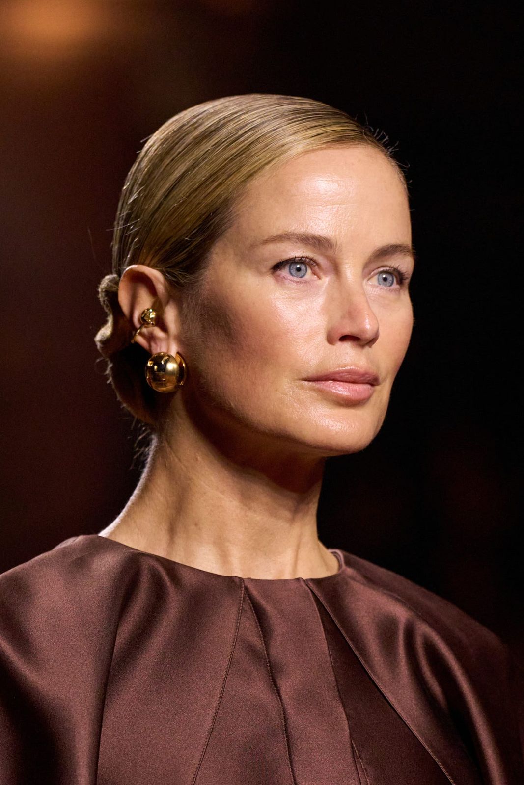 Sleek Blonde Low Bun With Slicked Back Parting Sleek Blonde Low Bun With Slicked Back Parting — Winter Formal Hairstyles