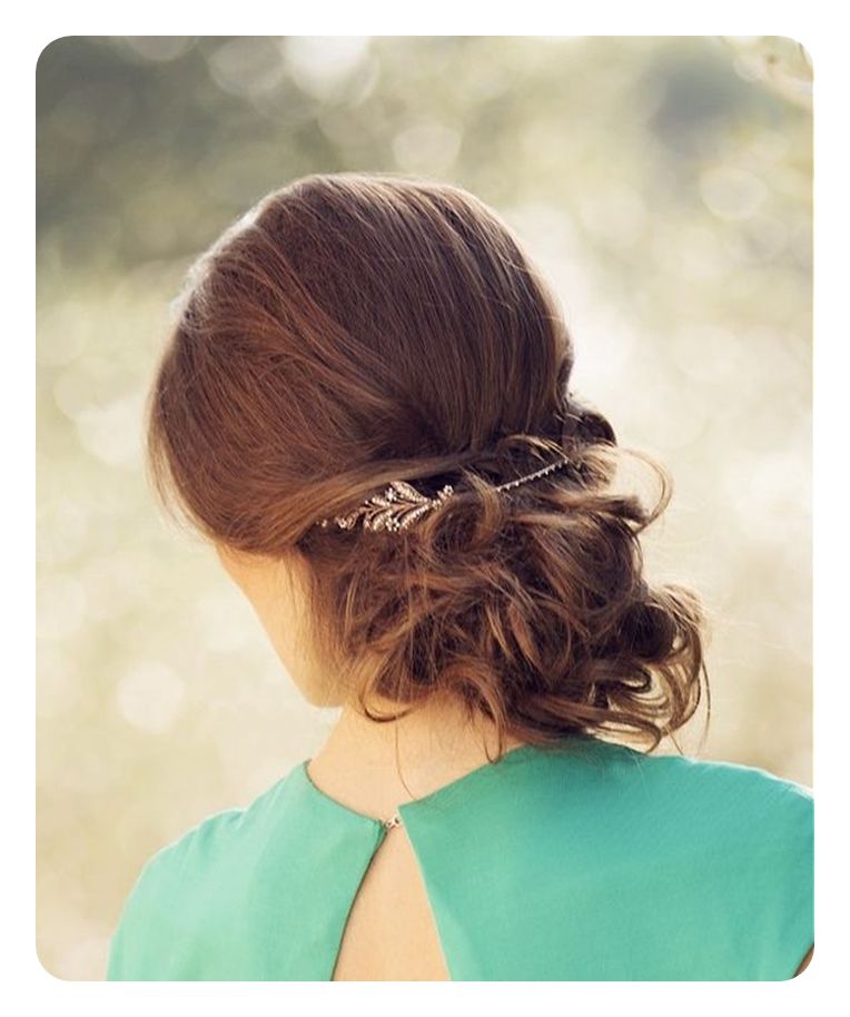 Dark Brown Messy Bun With Ornate Accessory — Winter Bun Hairstyles
