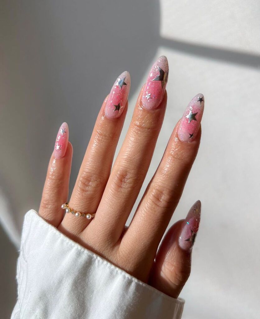 Glitter-Infused Stilettos with Star Foils Glitter-Infused Stilettos with Star Foils — New Years Gel Nails 2027
