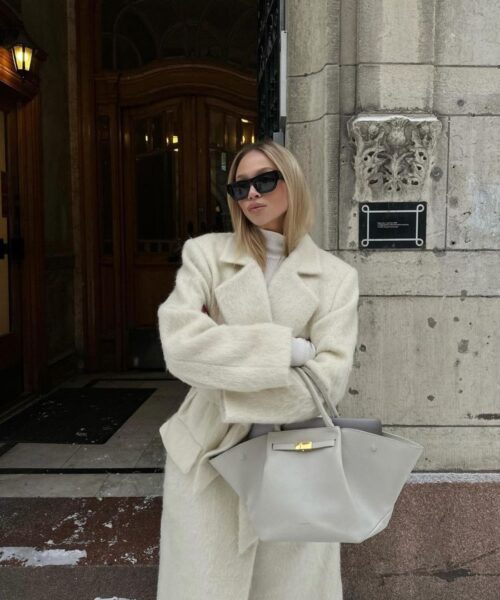 Ash Blonde Layered Bob with Curtain Bangs Ash Blonde Layered Bob with Curtain Bangs — Winter Haircuts for Round Faces