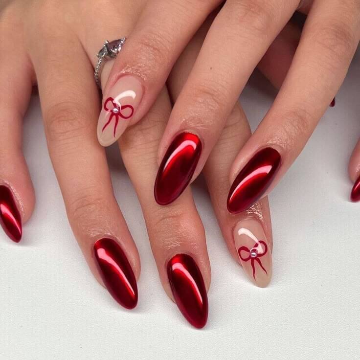 Metallic Red Chrome Bow Almond Nails Metallic Red Chrome Bow Almond Nails — Cherry Red Christmas Nails 2026