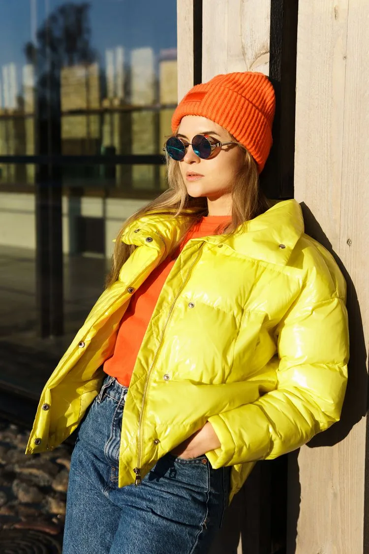 Blonde Mid-Back Waves With Orange Beanie — Winter Hat Hairstyles