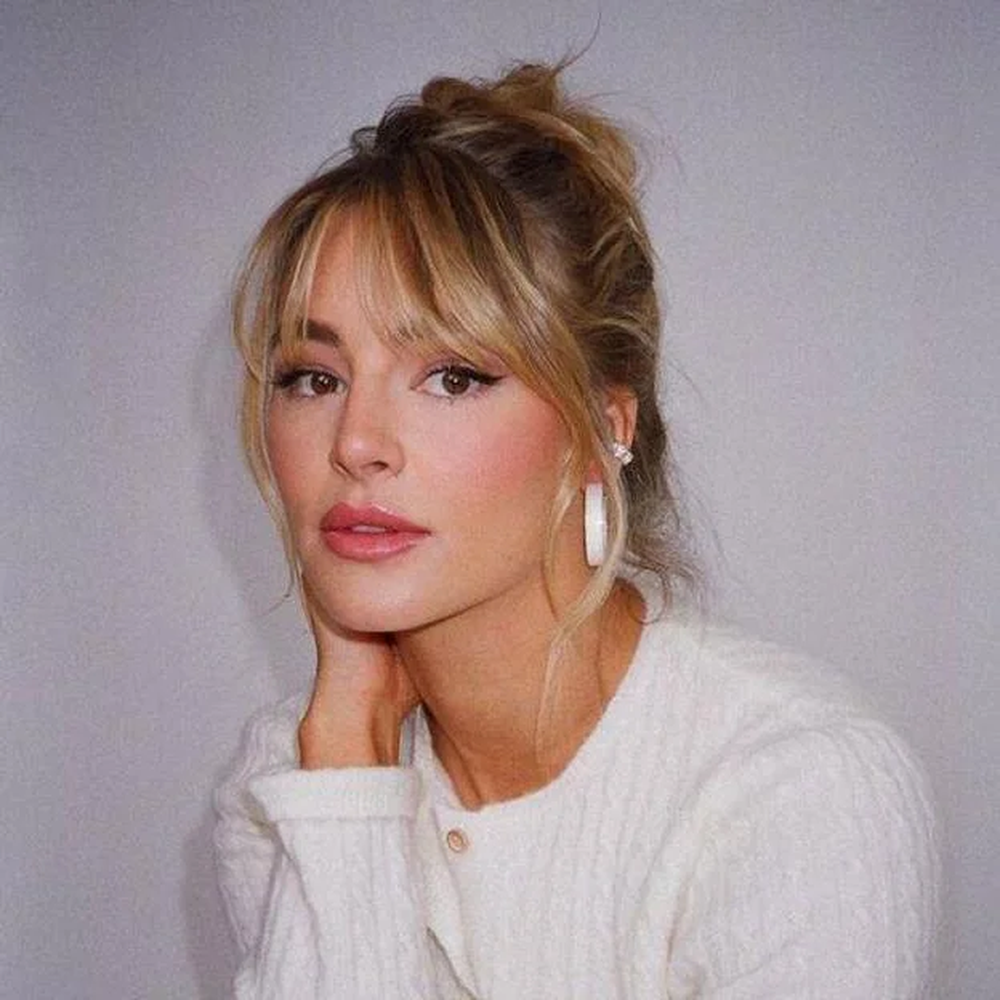 Long Blonde Messy Bun With Wispy Bangs Long Blonde Messy Bun With Wispy Bangs — Winter Haircuts with Bangs