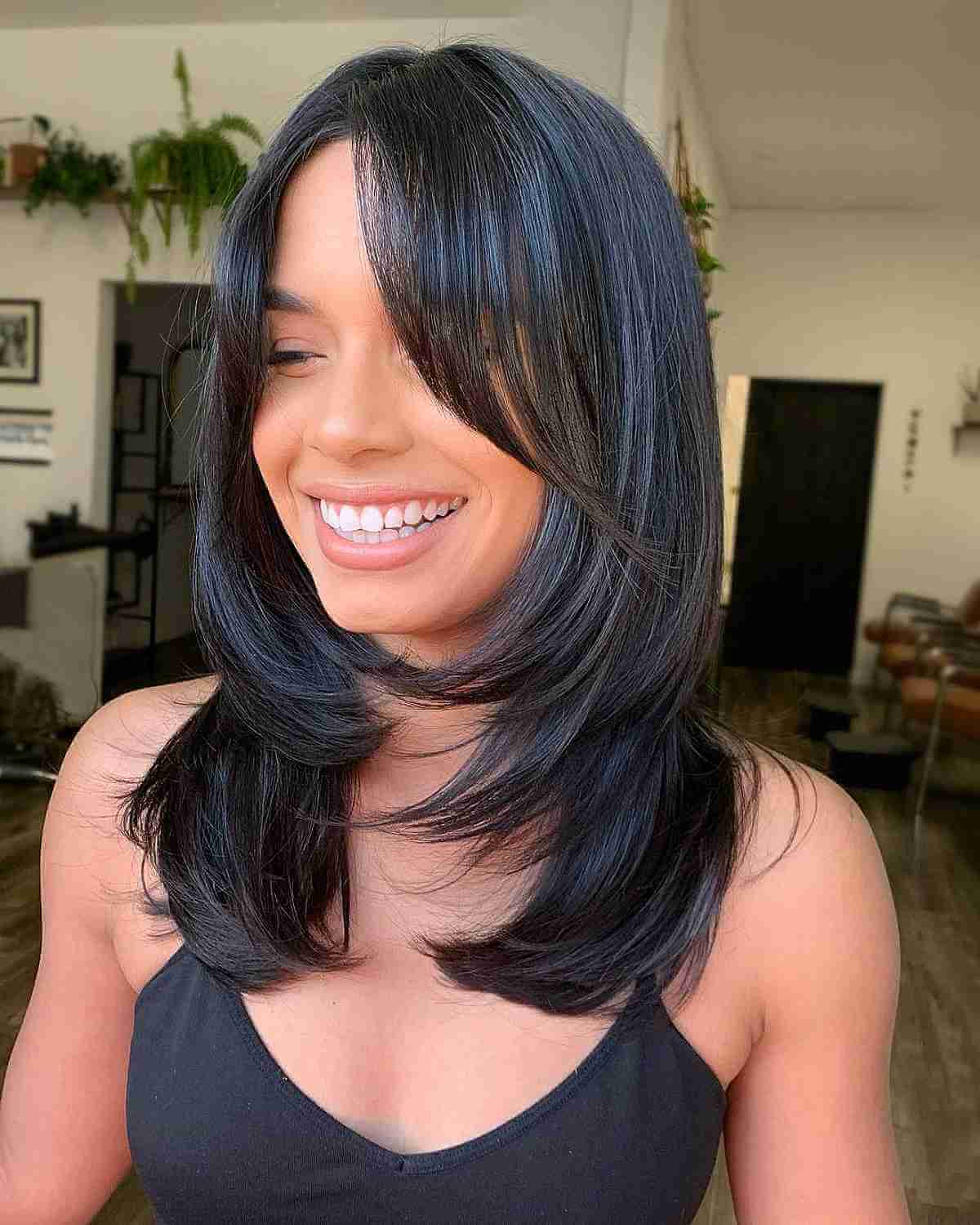 Sleek Dark Brown Lob With Side-Swept Bangs Sleek Dark Brown Lob With Side-Swept Bangs — Winter Layered Haircuts